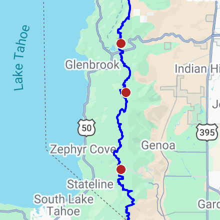 A section of Google Maps showing part of Lake Tahoe and land east of it. A blue line highlights the Tahoe Rim Trail, with several red GPS pins along it.